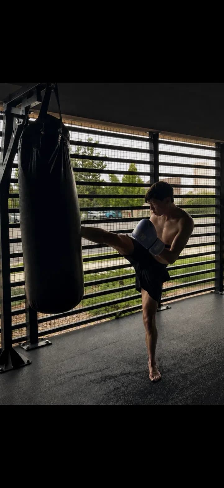 Roosevelt training Muay Thai on the heavy bag